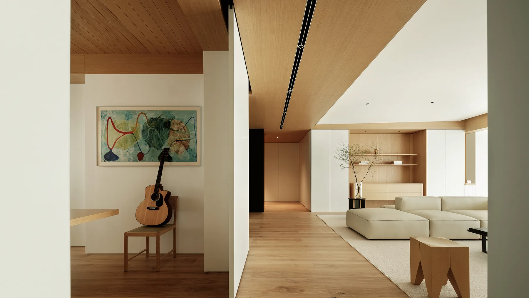 An interior where furniture and lighting are resolved together